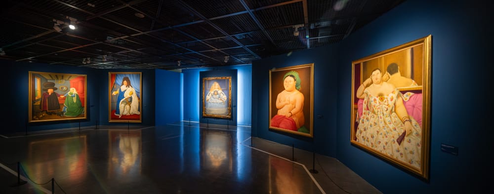 Exhibition hall with Botero paintings and sculpture