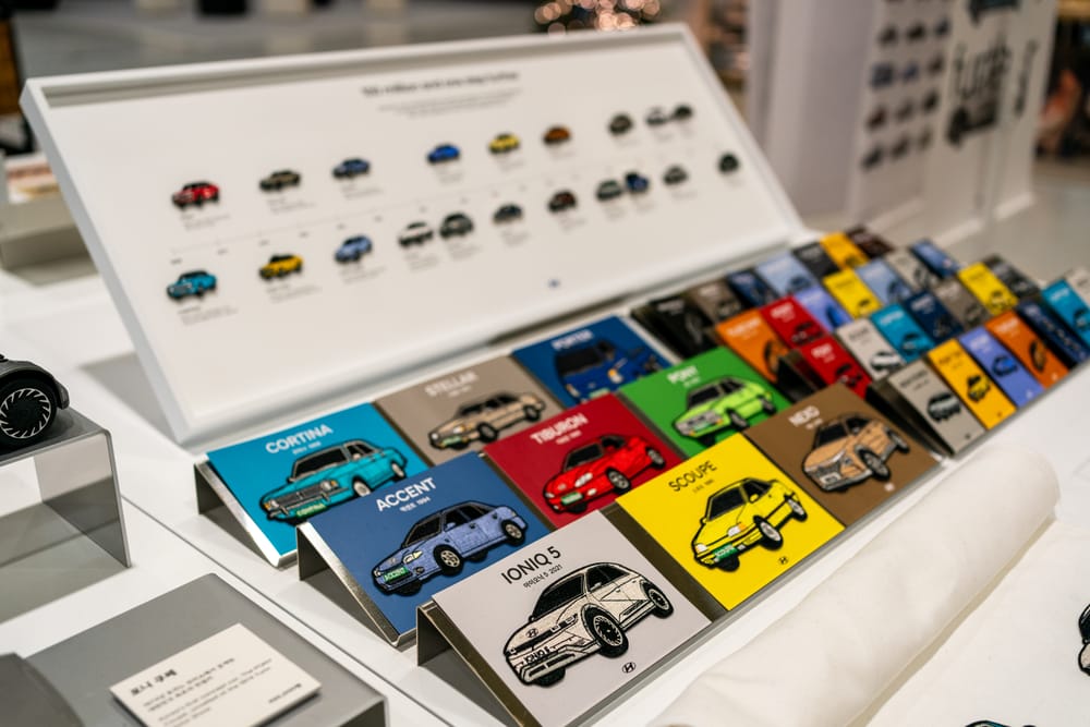 Scale models and design cards shown in the pavilion