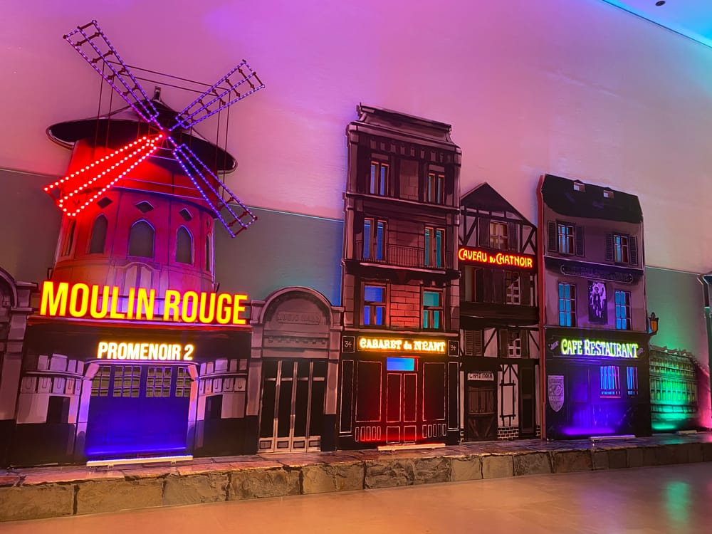 Moulin Rouge facade recreated in neon inside the exhibition